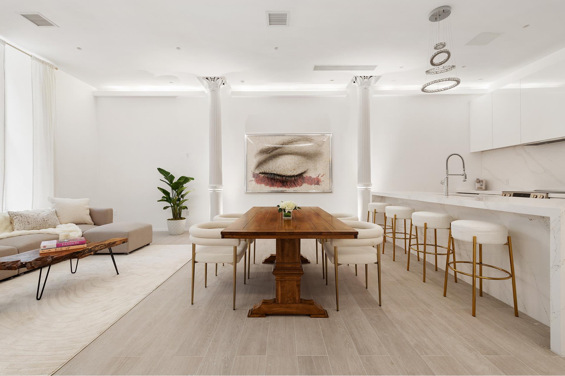 a dining room with furniture and wooden floor