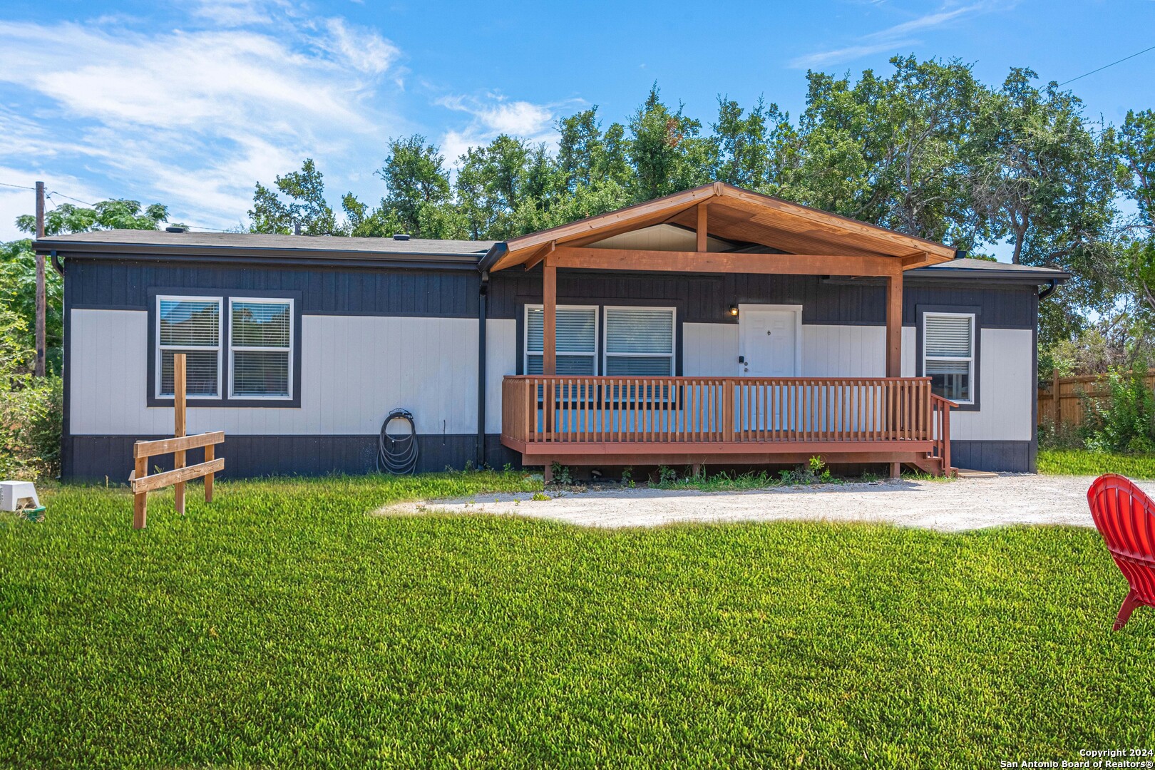 a view of backyard with a garden and deck