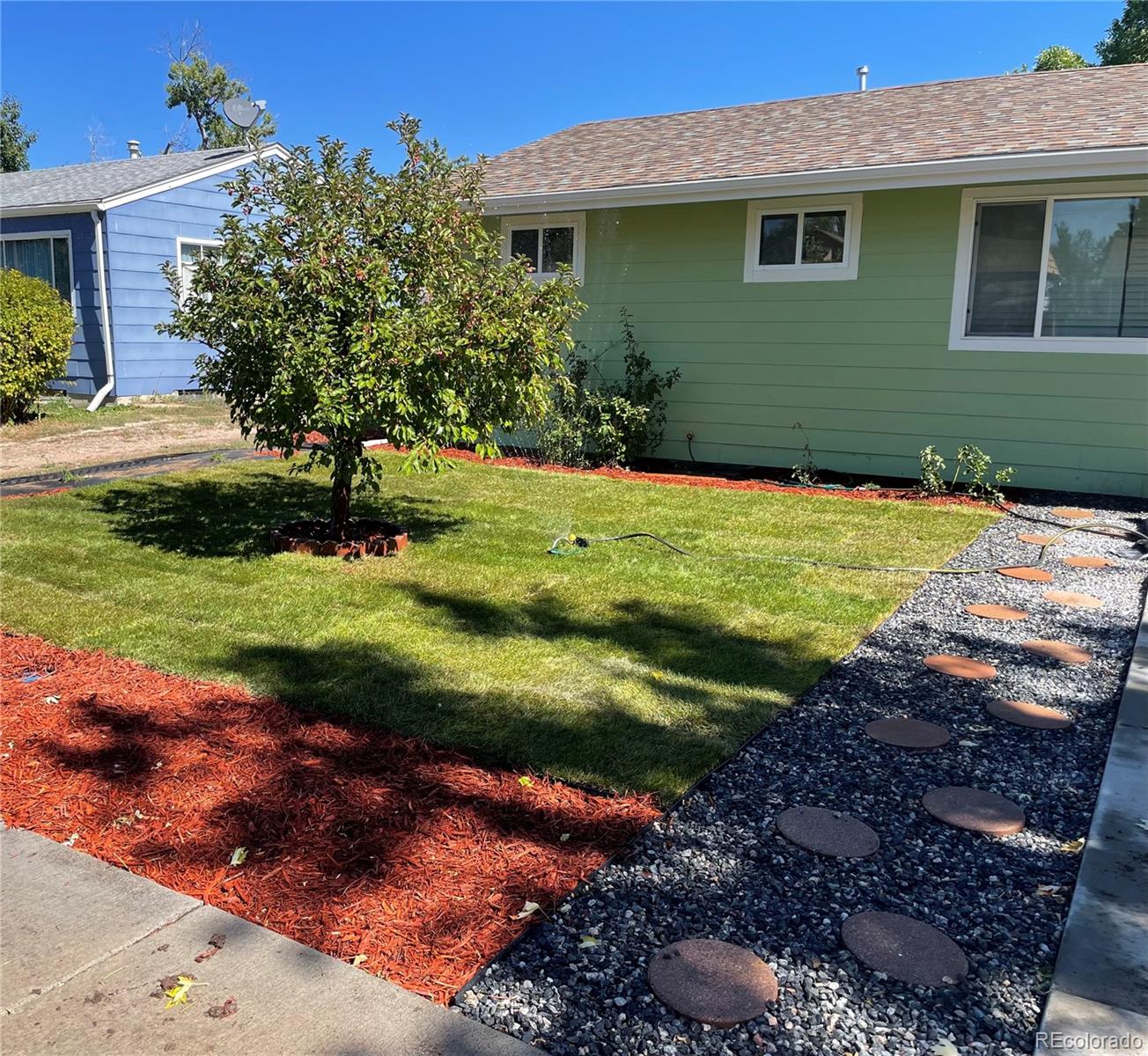 a front view of a house with a yard