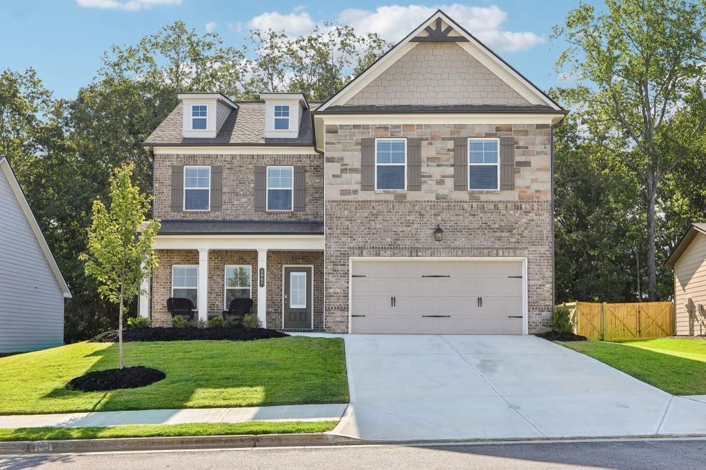 a front view of a house with a yard