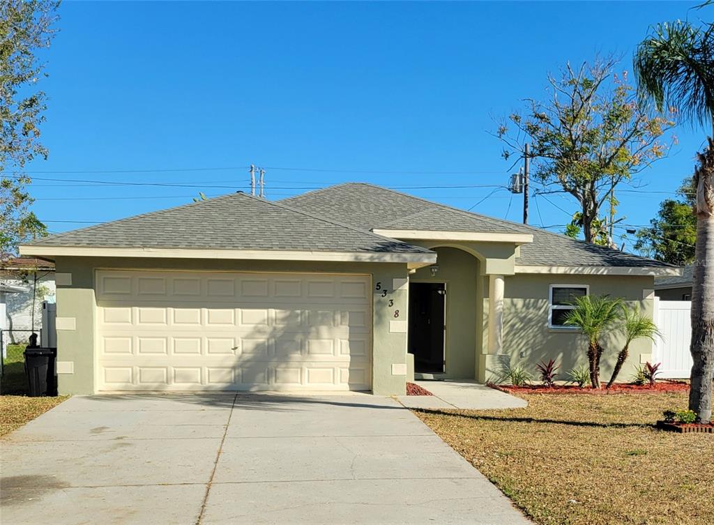 a front view of a house with a garage