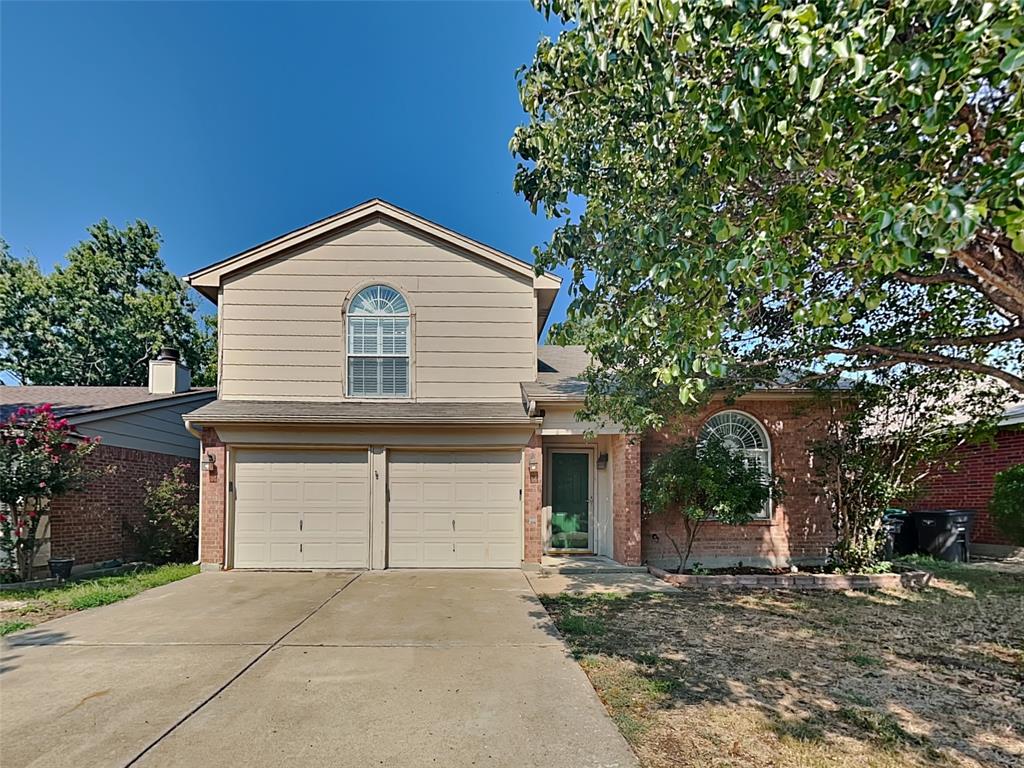 a front view of a house with a garage