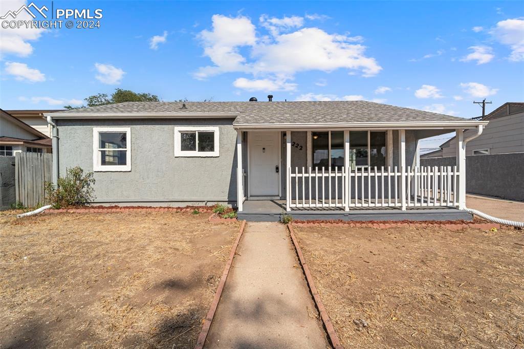 front view of a house with a yard