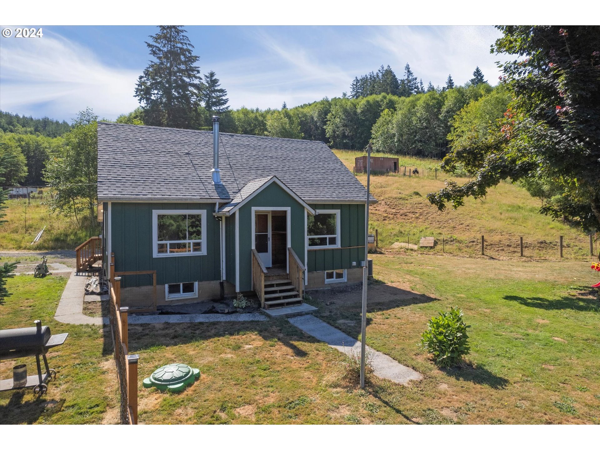 a aerial view of a house with table and chairs