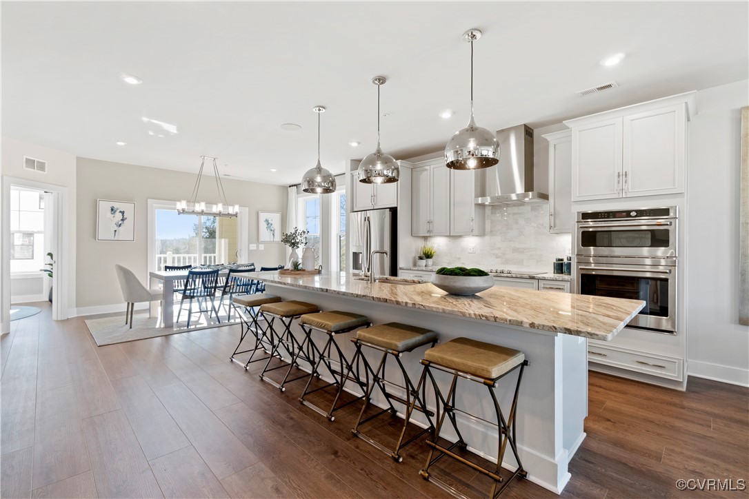 a large kitchen with kitchen island a large island in the center