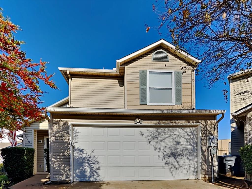 a view of a house with a garage