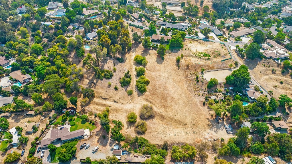 an aerial view of a houses with a yard