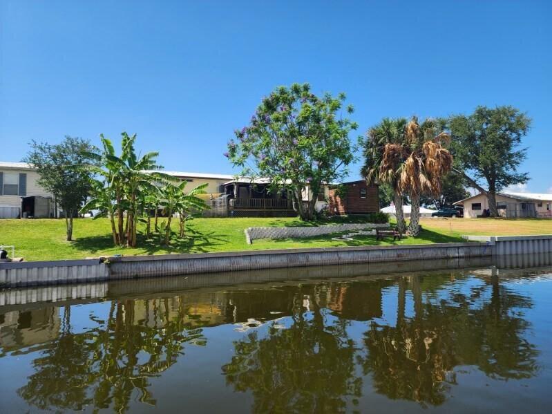 a view of swimming pool with a yard