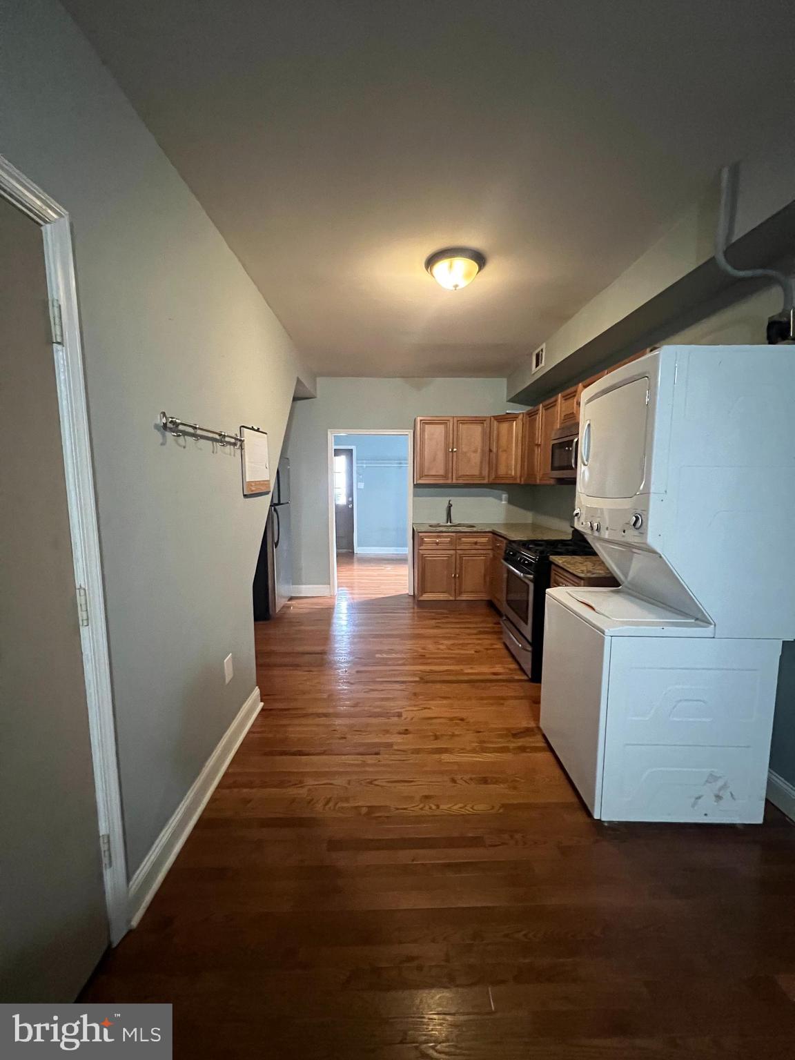 a view of kitchen with furniture and wooden floor