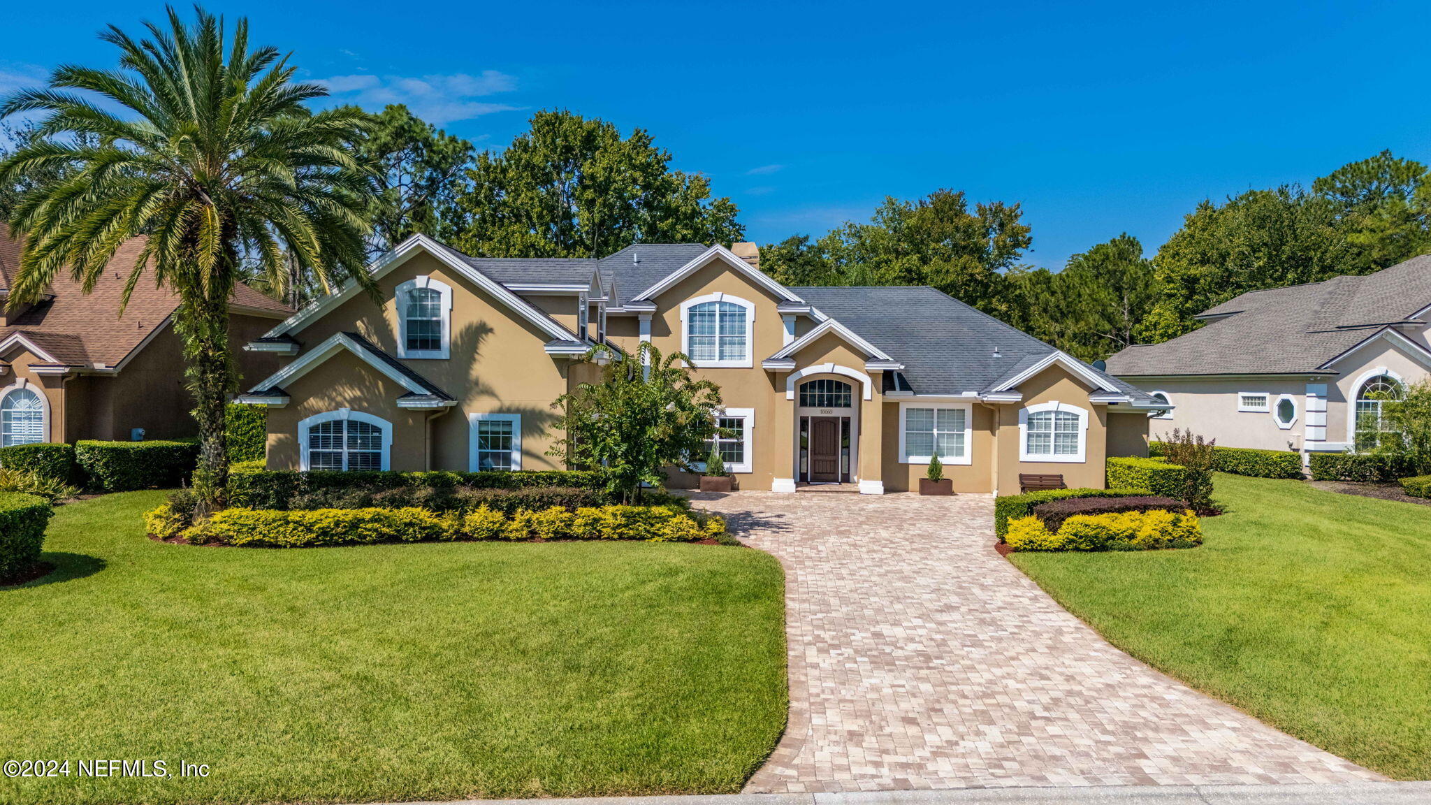 a front view of a house with a yard