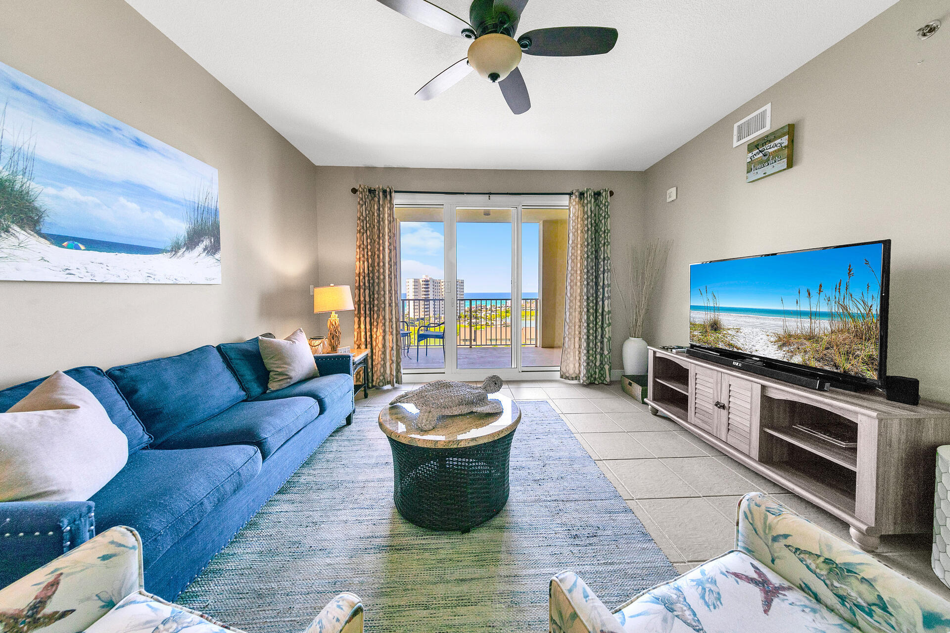 a living room with furniture and a flat screen tv