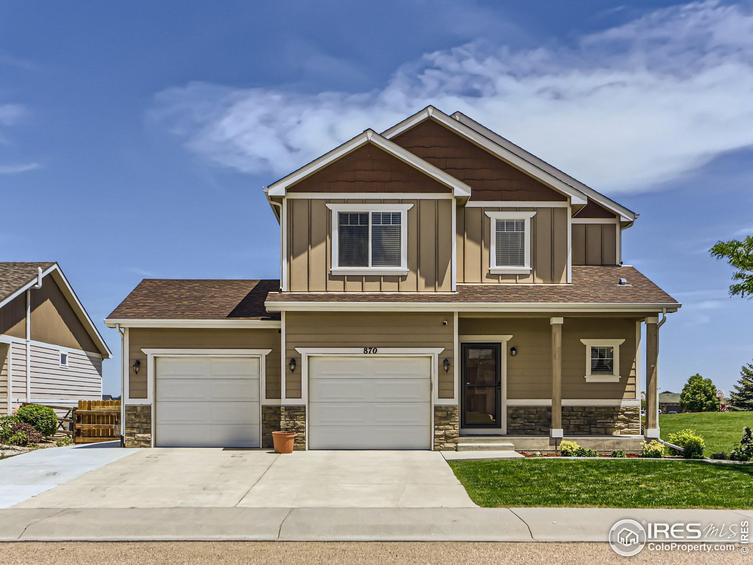 a front view of a house with yard