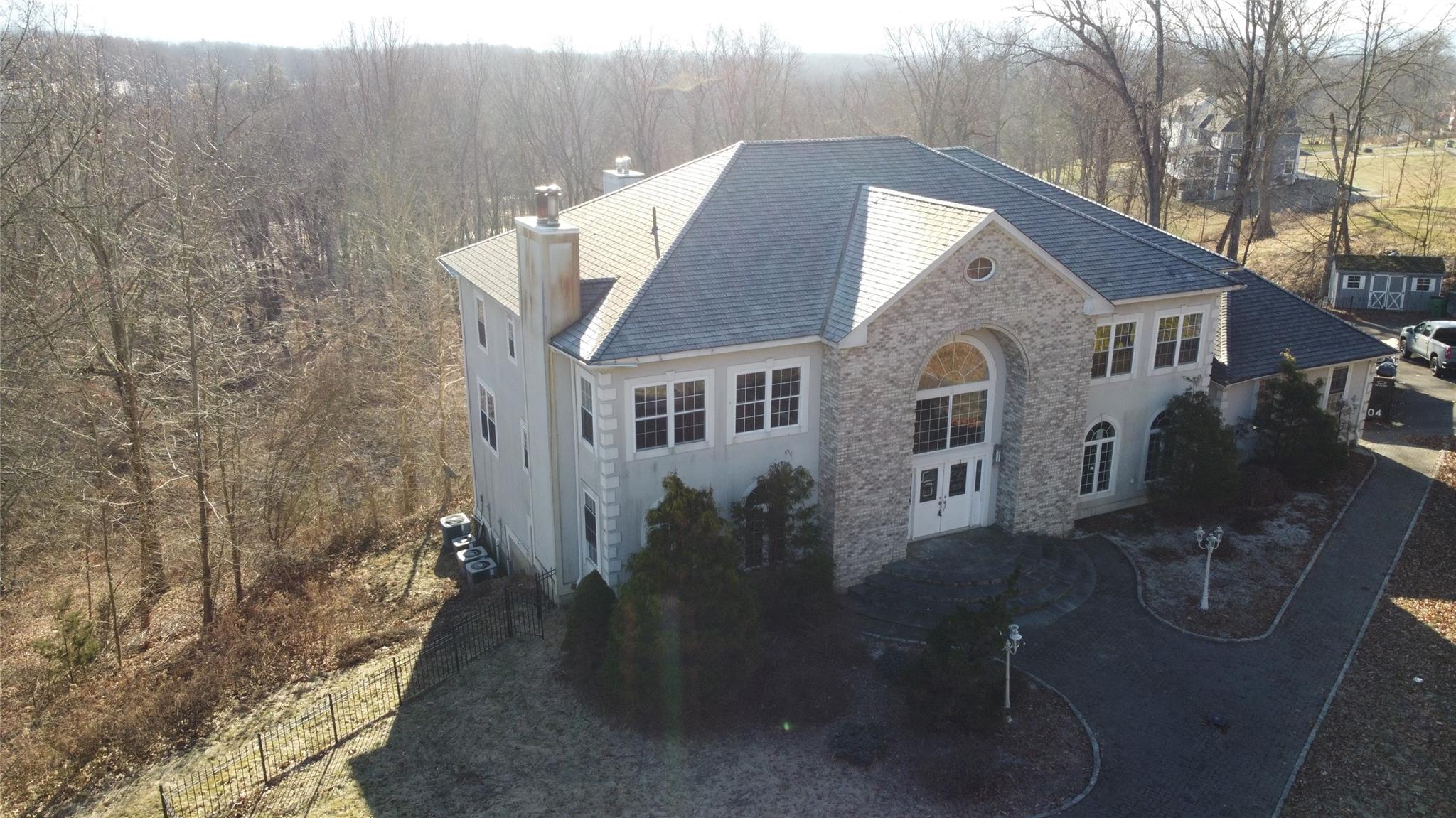 a aerial view of a house with table and chairs