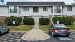 a view of a car park in front of house