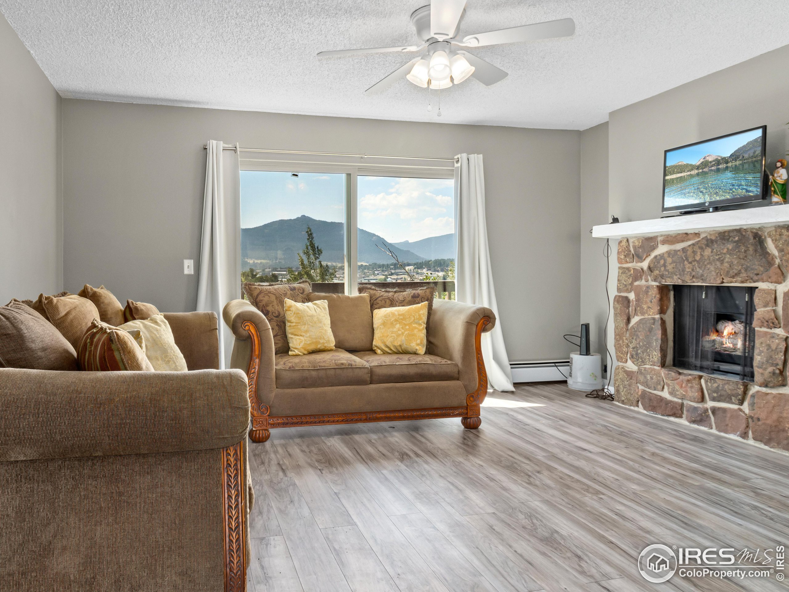 a living room with furniture and a fireplace