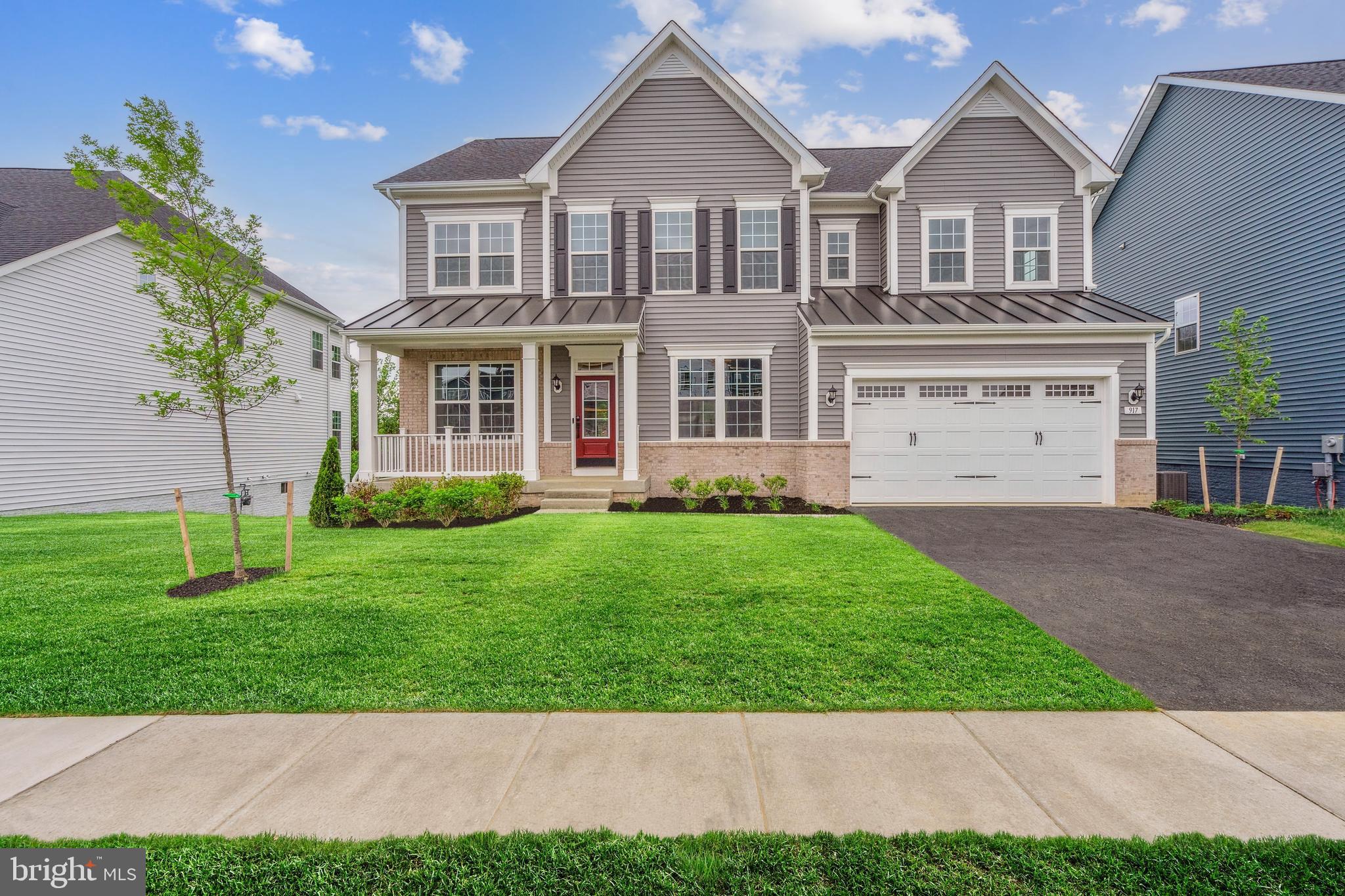 front view of a house with a yard