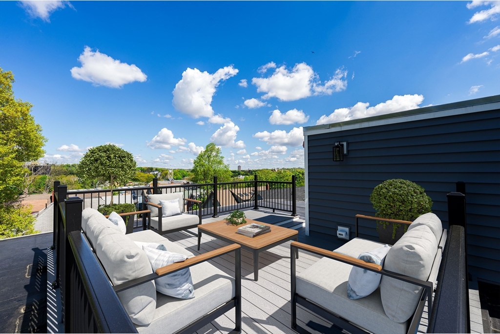 a terrace of a house with outdoor seating