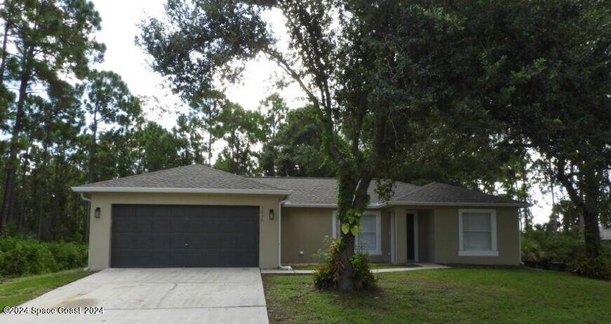 front view of a house with a yard