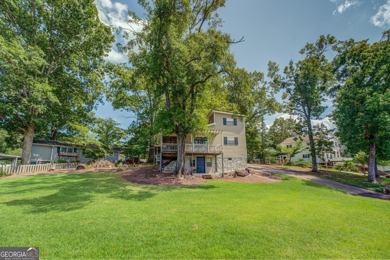 a view of a house with a yard porch and sitting area