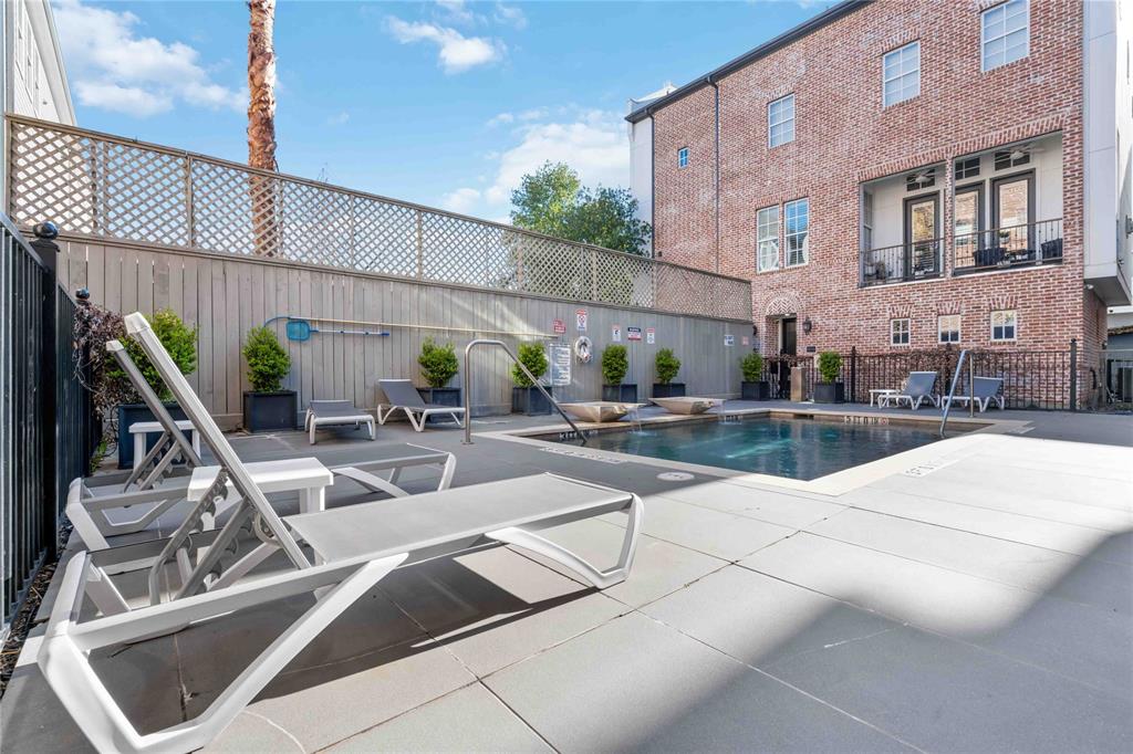 a view of a patio with a table and chairs