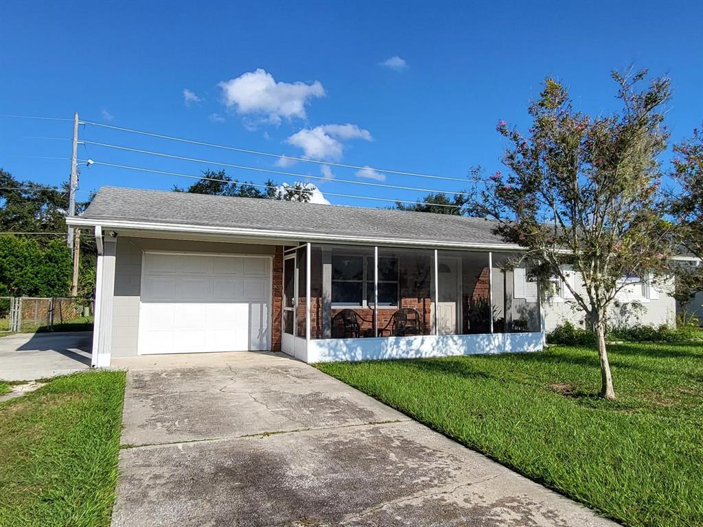 a front view of a house with garden and porch