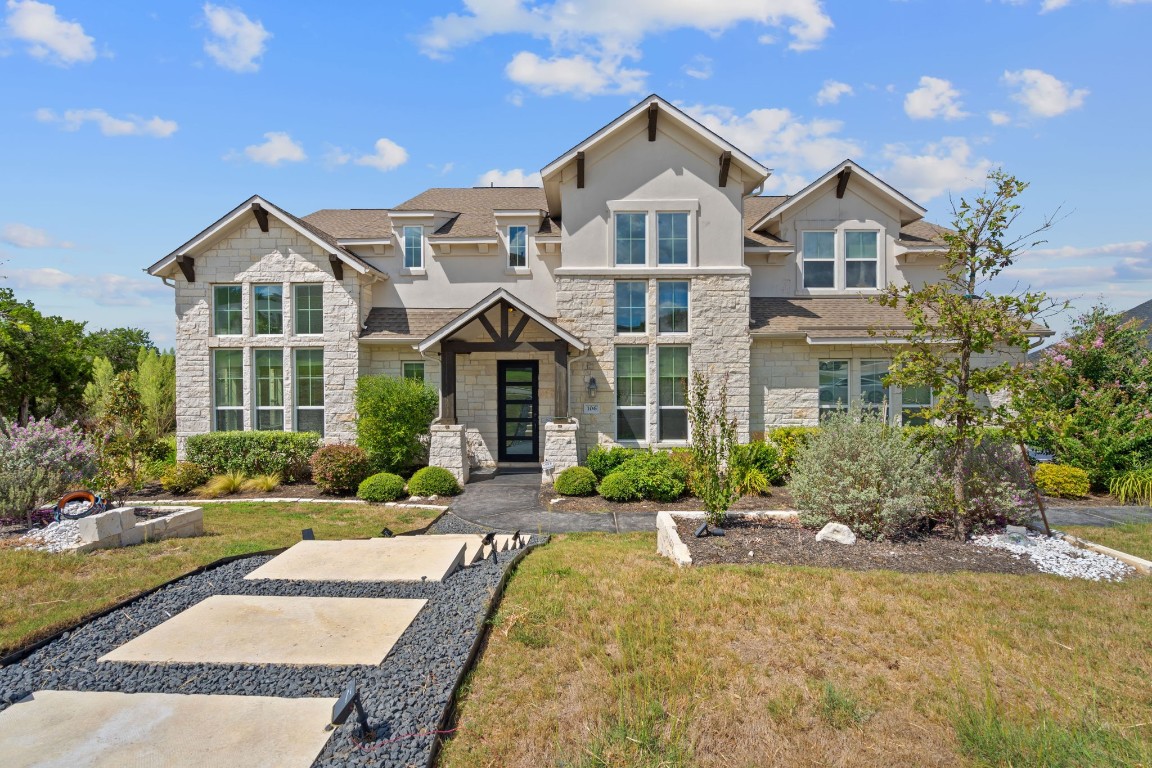 a front view of a house with a yard