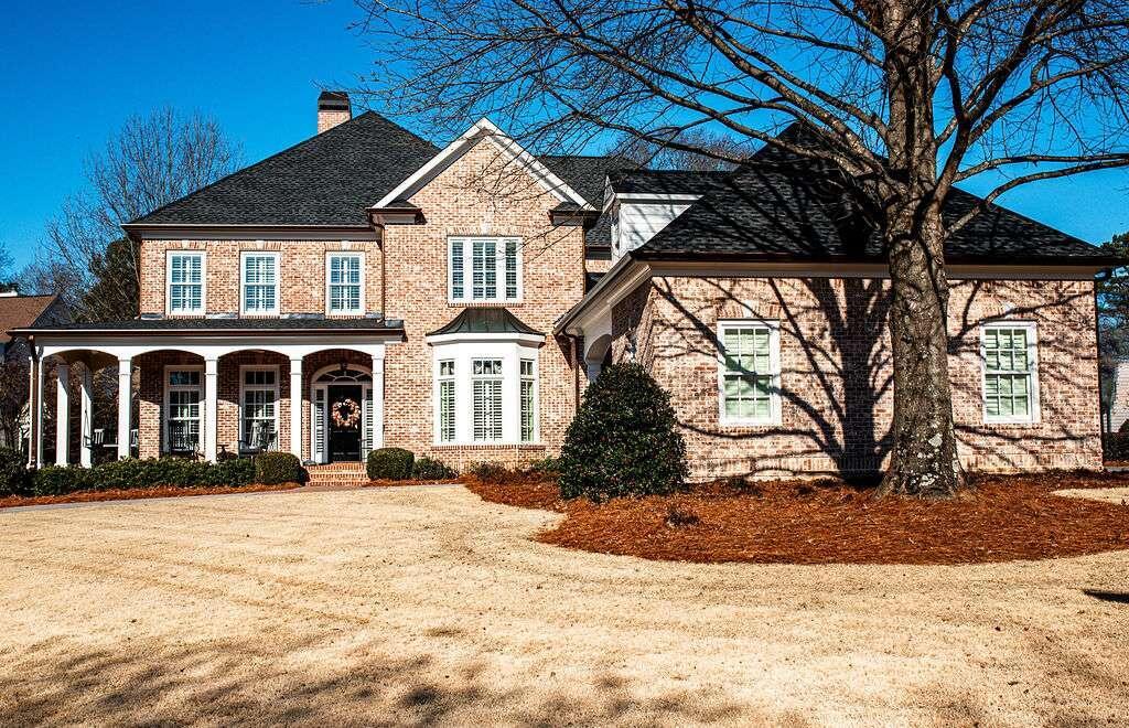 a front view of a house with a yard