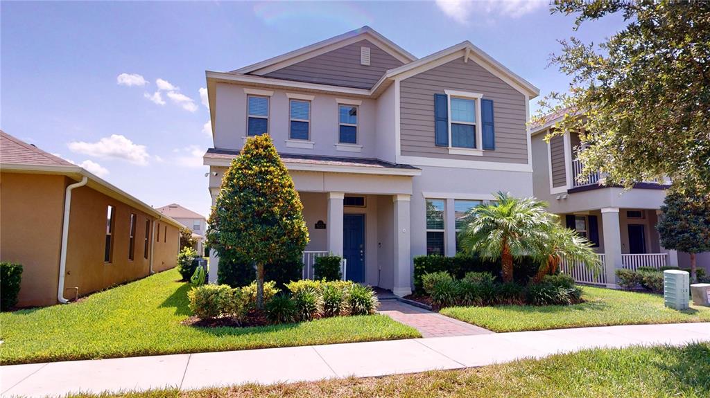 a front view of a house with a yard