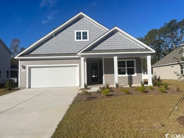 View of front of property with a garage and a fron