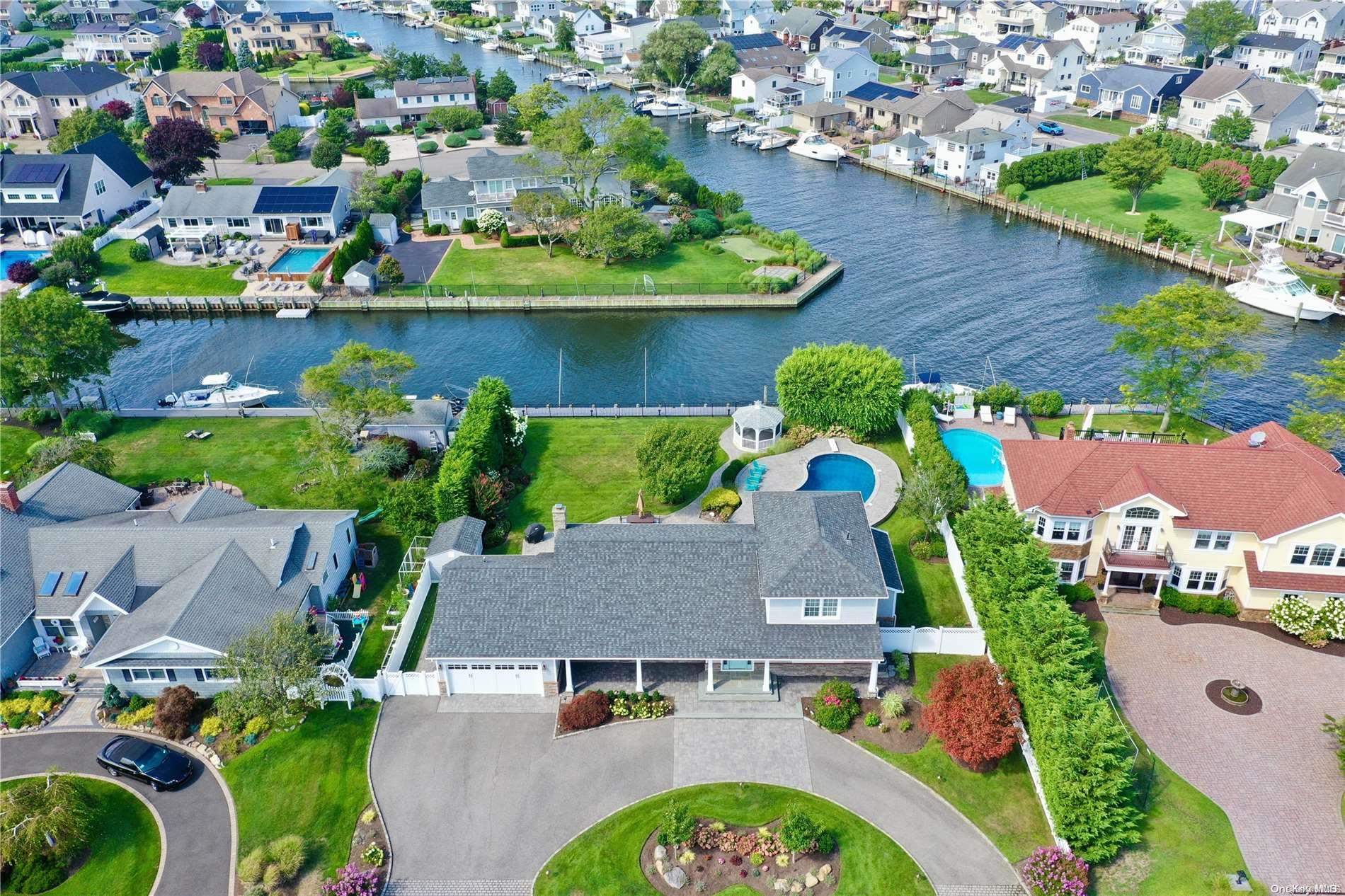 an aerial view of house with yard swimming pool and outdoor seating