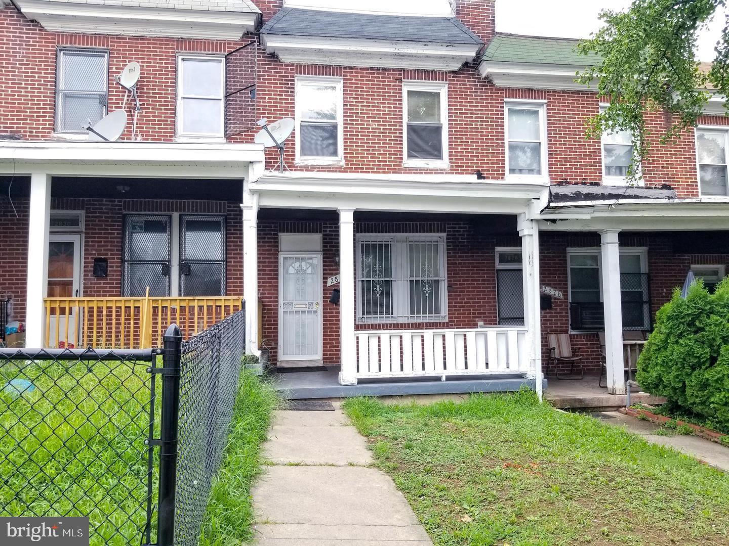 a view of a brick building with a yard