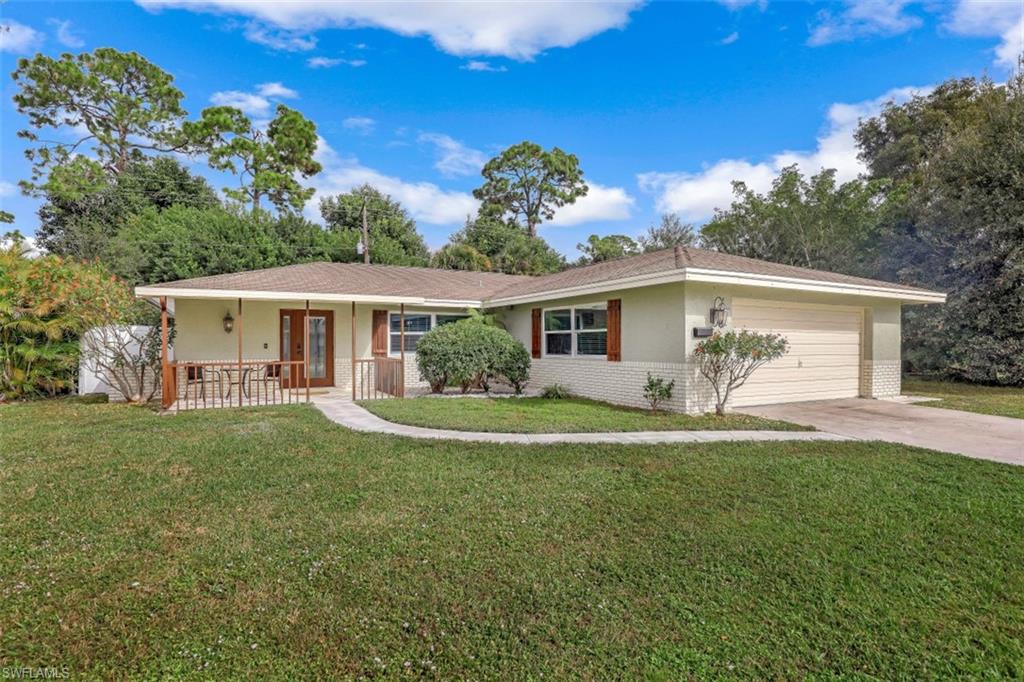 front view of a house with a yard