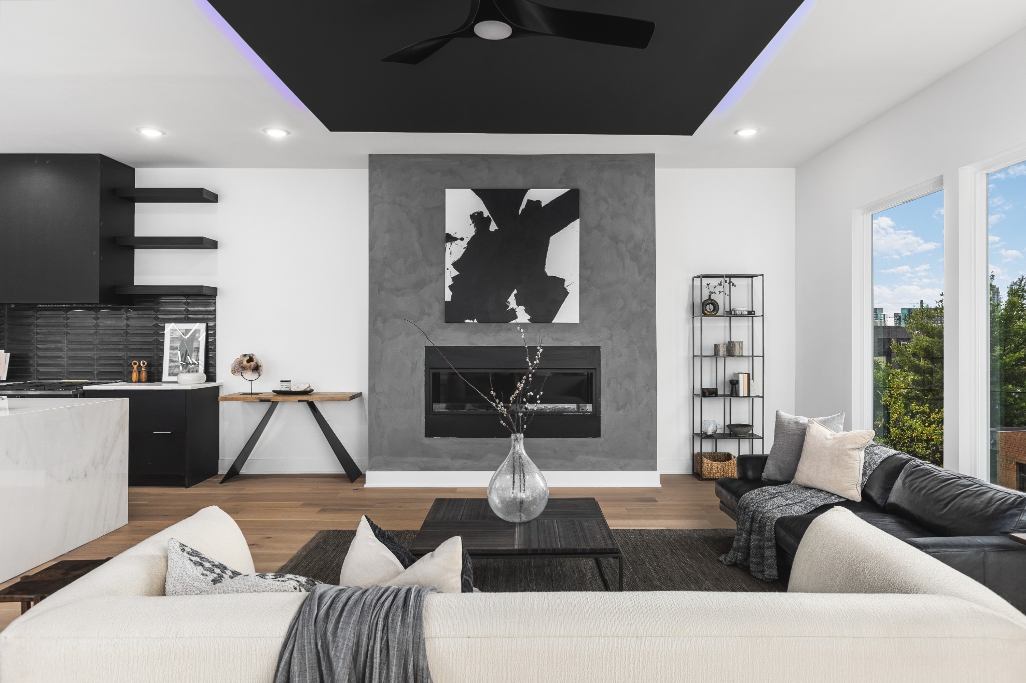 a living room with furniture a fireplace and a flat screen tv