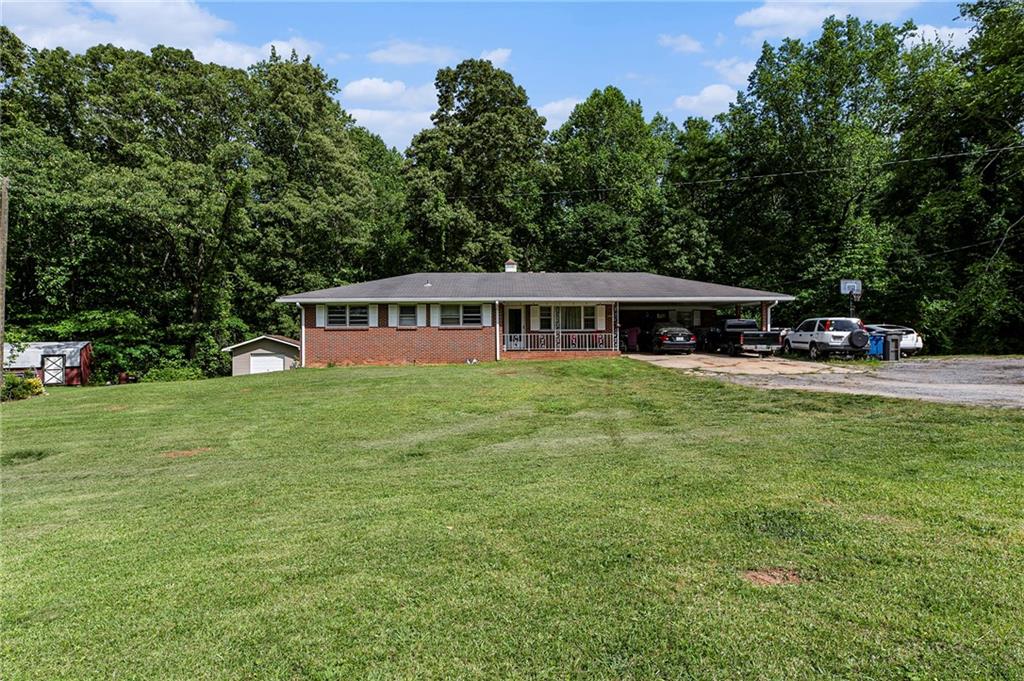 a view of a house with a big yard