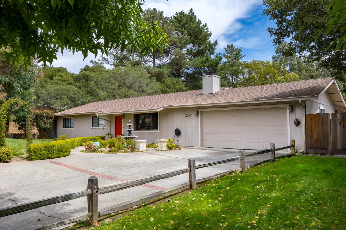 a front view of a house with a yard