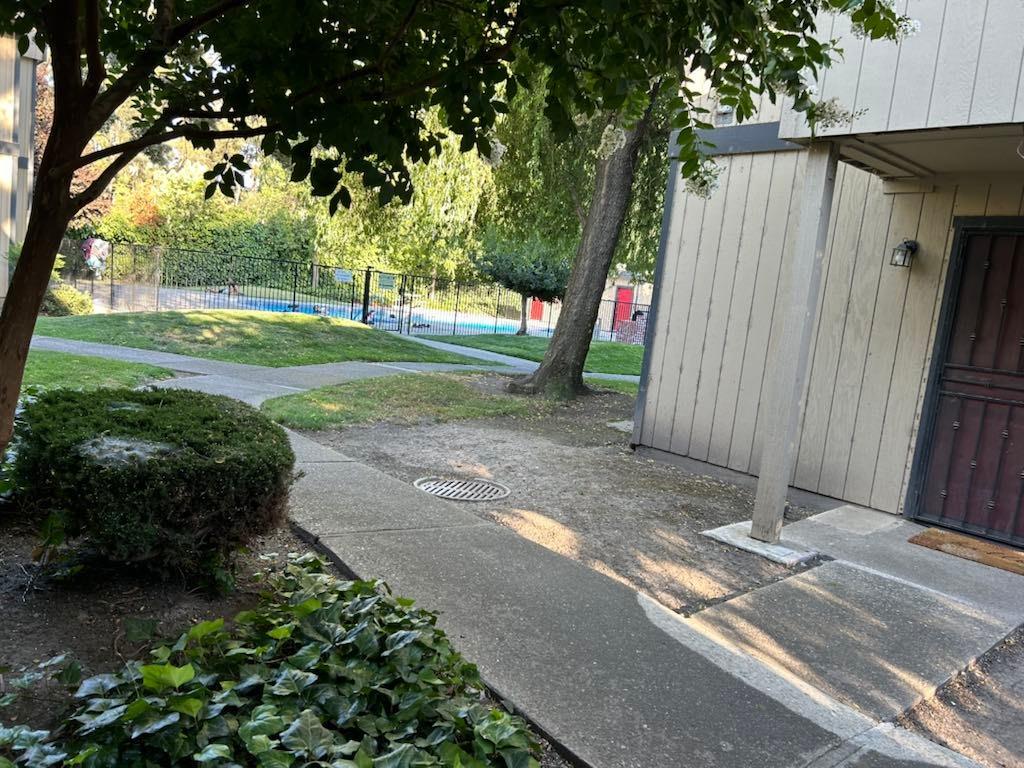 a view of backyard with green space