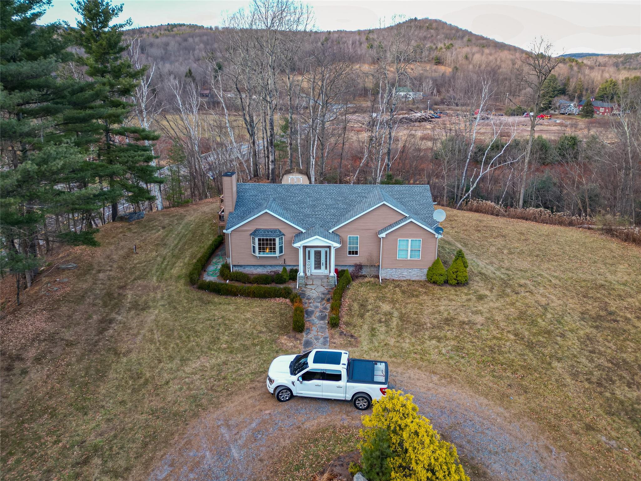 Drone / aerial view featuring a mountain view