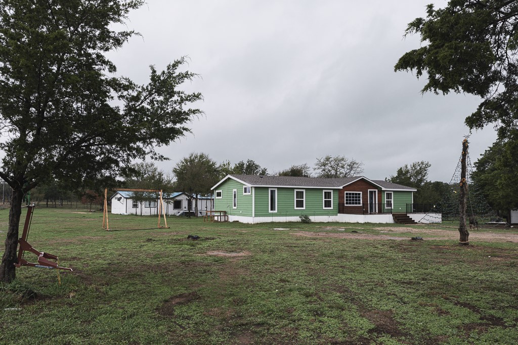 a view of a house with a big yard