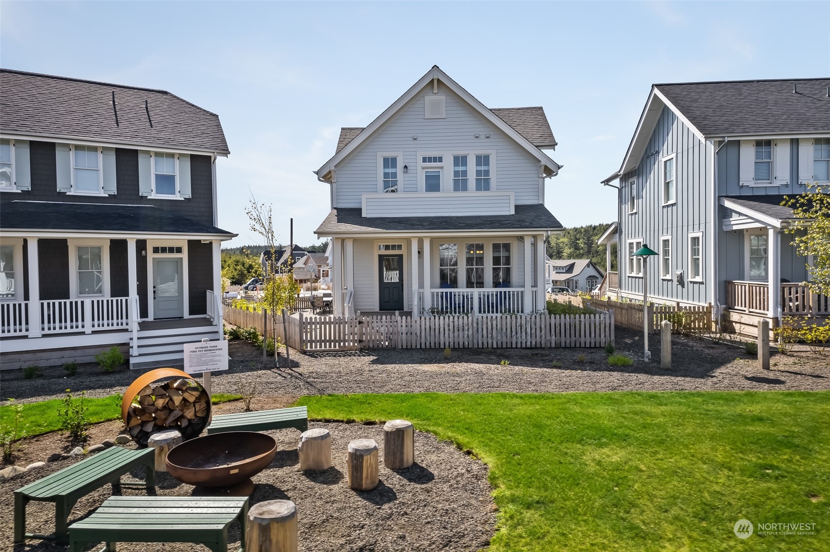 a view of a yard with furniture and a fire pit