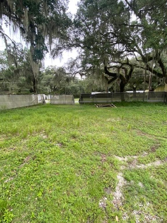 a view of backyard with green space