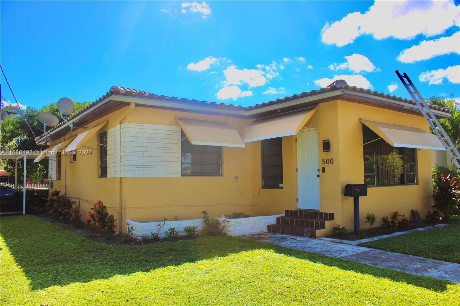 a front view of a house with a yard