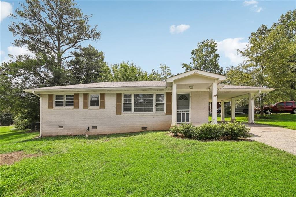 a front view of house with yard and green space