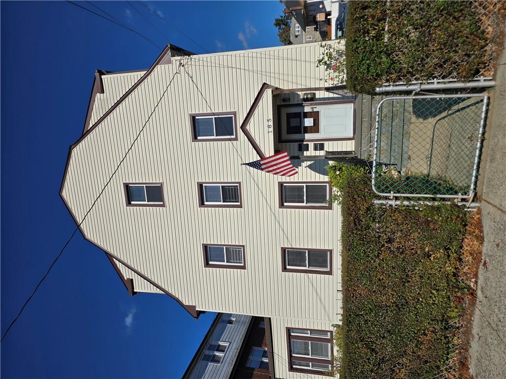 a front view of a house with yard