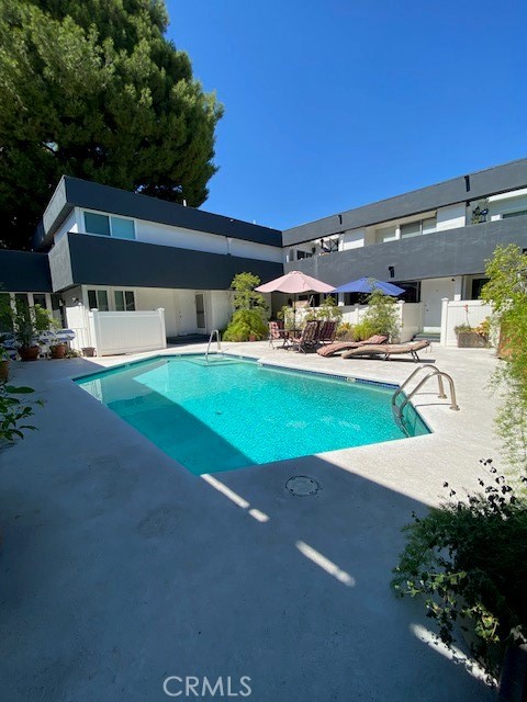 a view of a house with a yard and garage