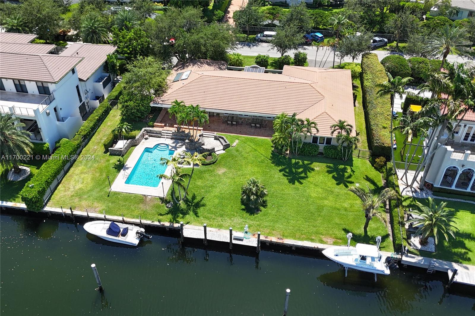 an aerial view of a house with a yard basket ball court and outdoor seating