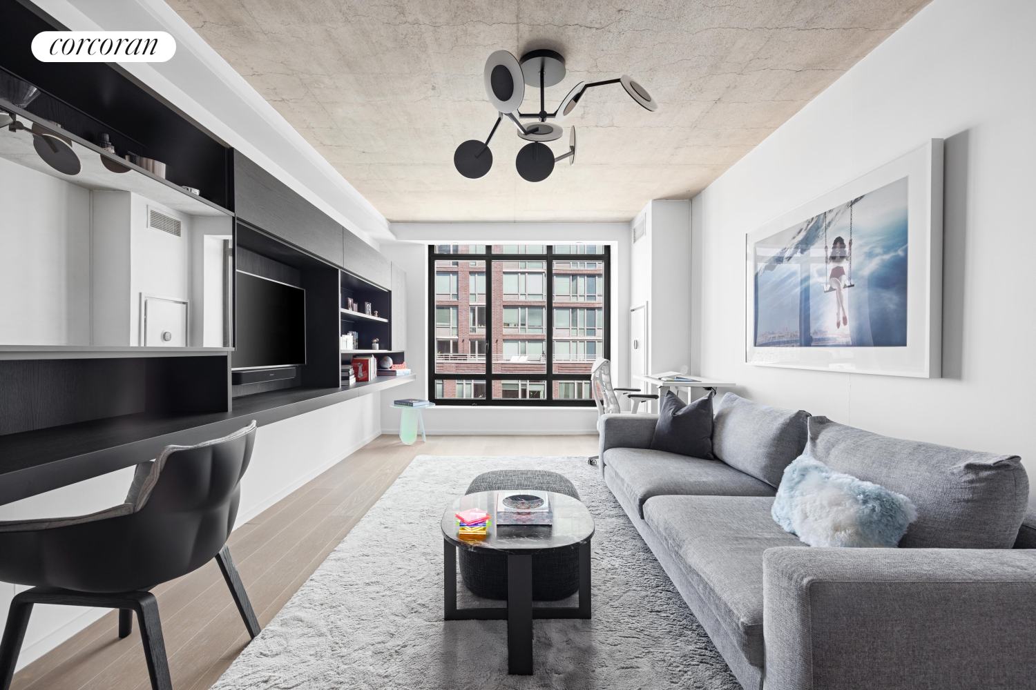 a living room with furniture and a flat screen tv