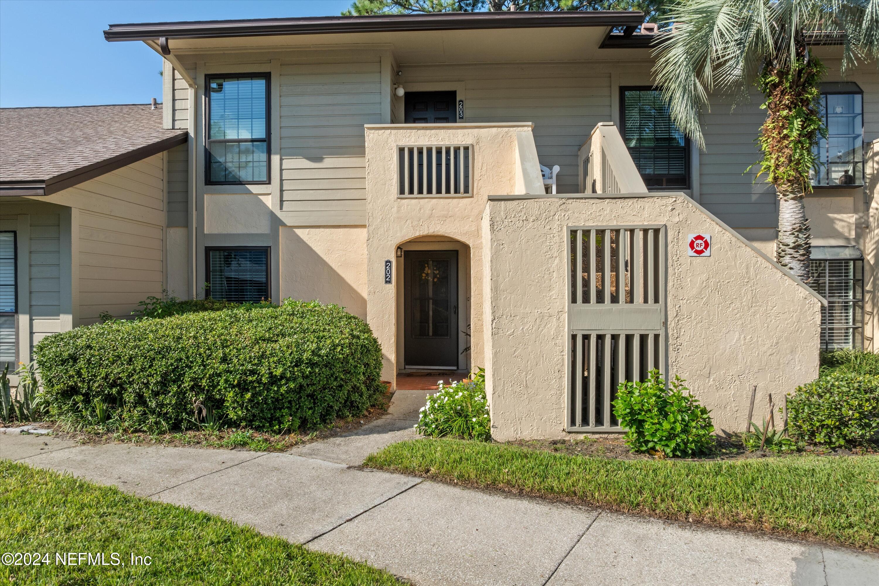 a front view of a house with garage