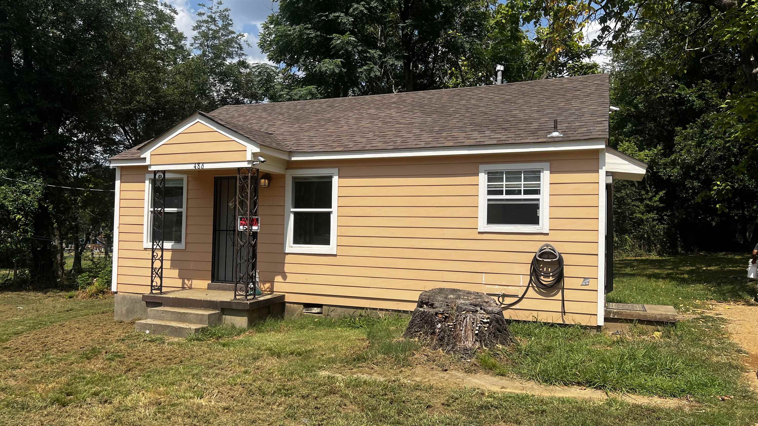 a front view of a house with a yard