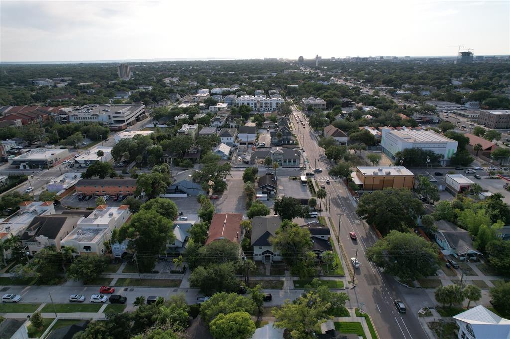 an aerial view of residential houses with city view