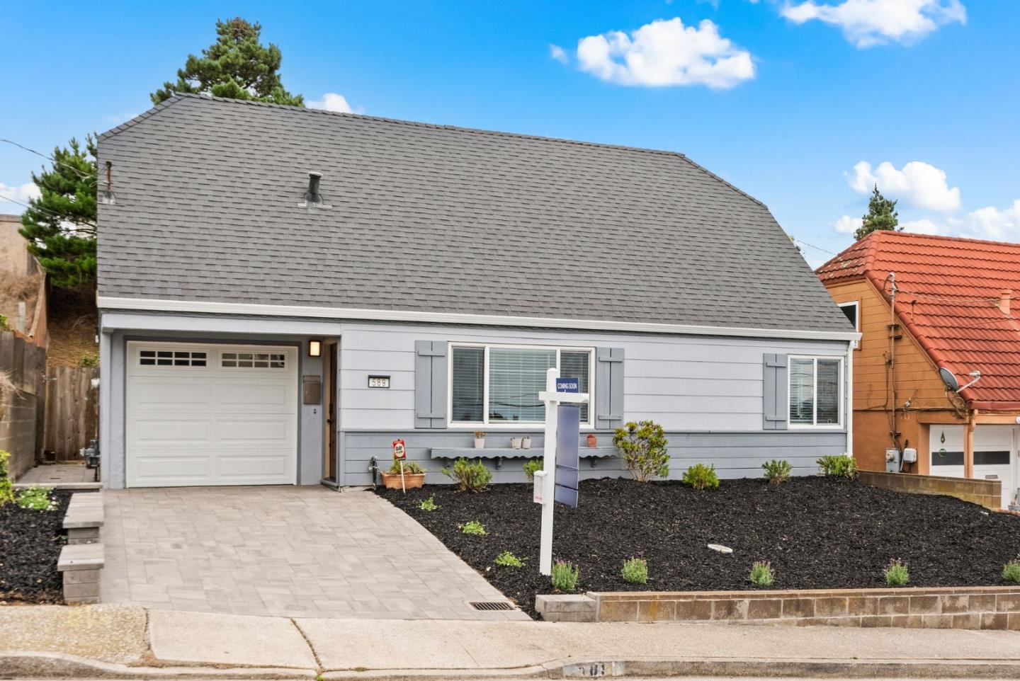 a front view of a house with yard